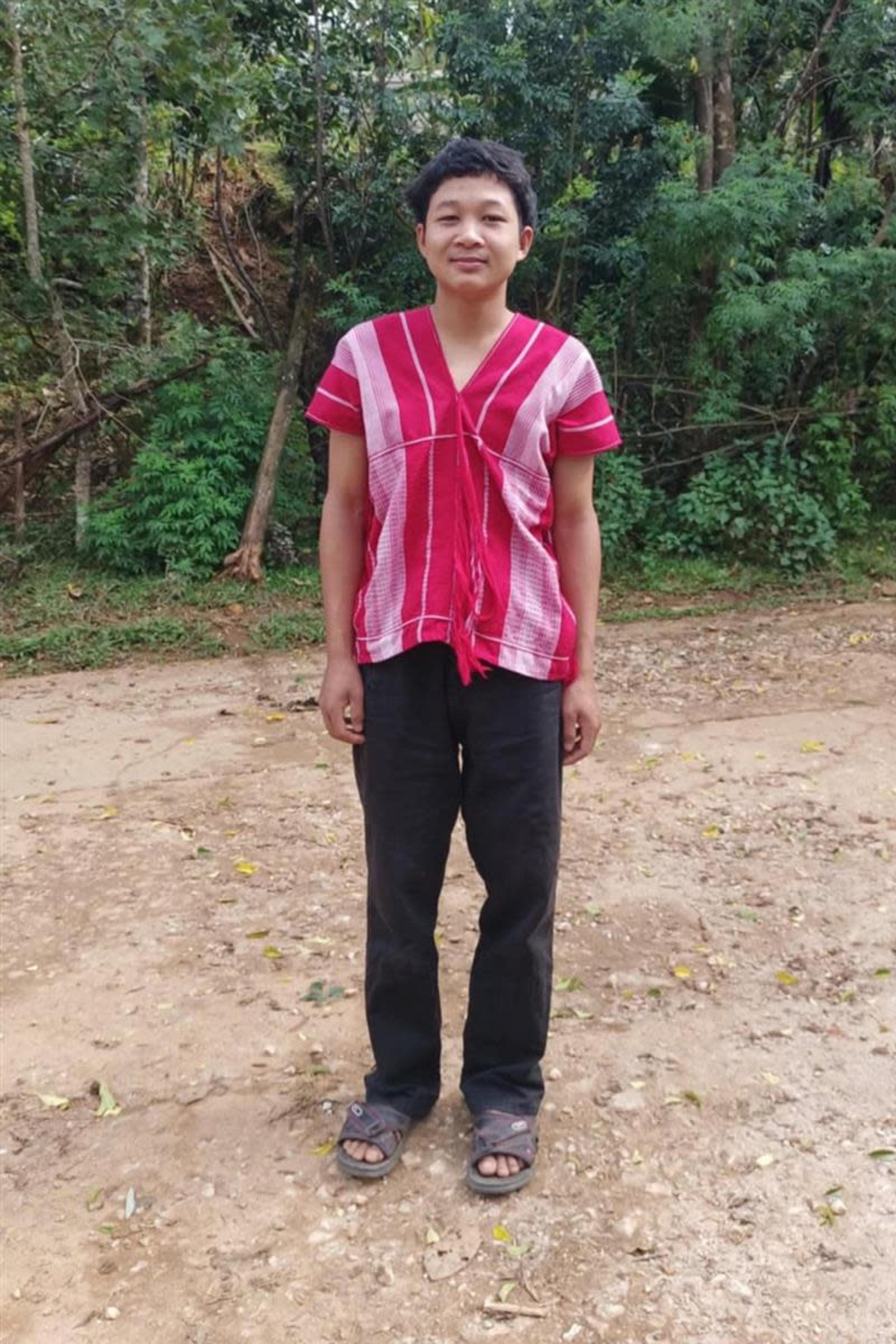 An unsponsored boy named Taweerat from Thailand who has waited 449 days for a sponsor.