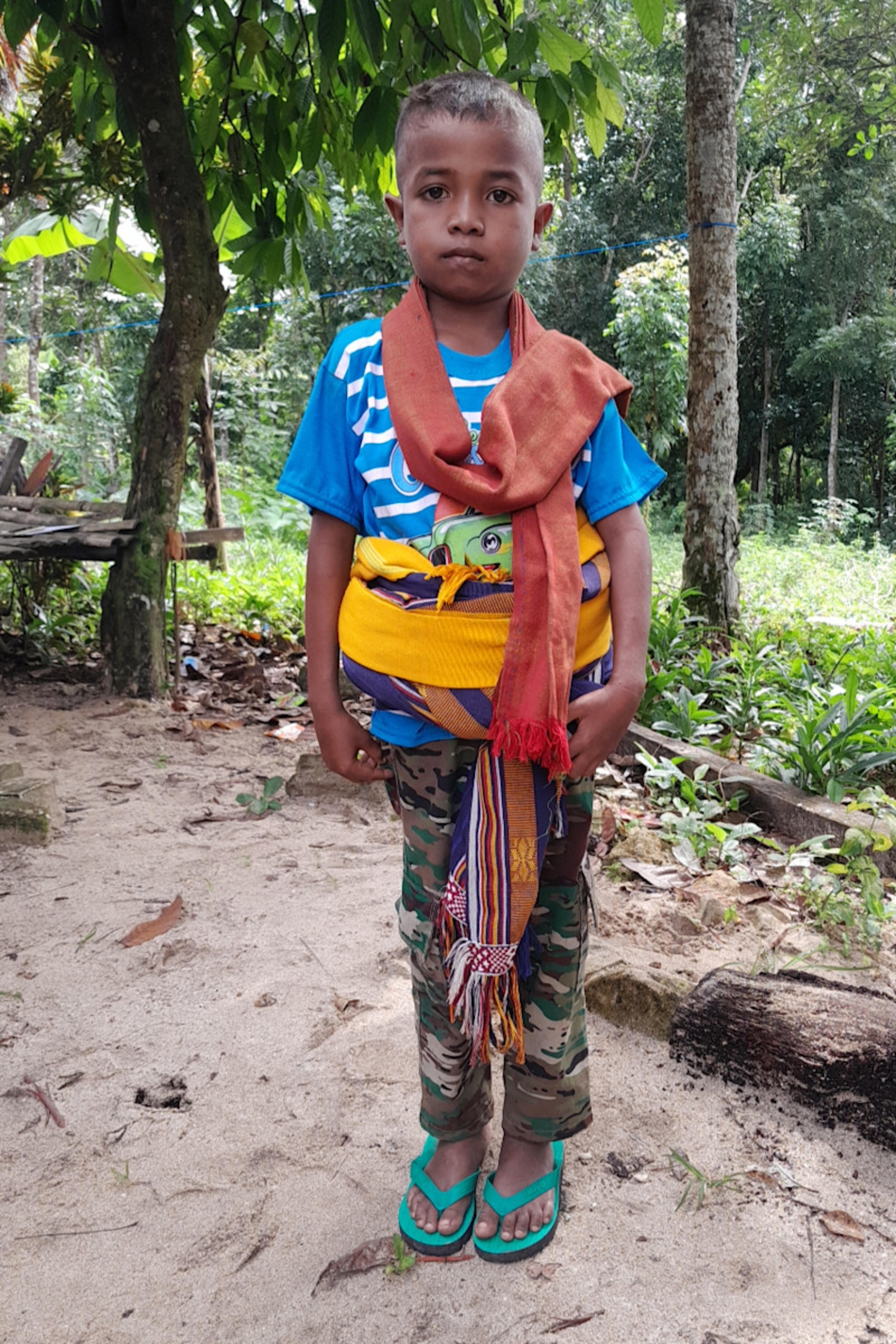 An unsponsored boy named Domi from Indonesia who has waited 513 days for a sponsor.