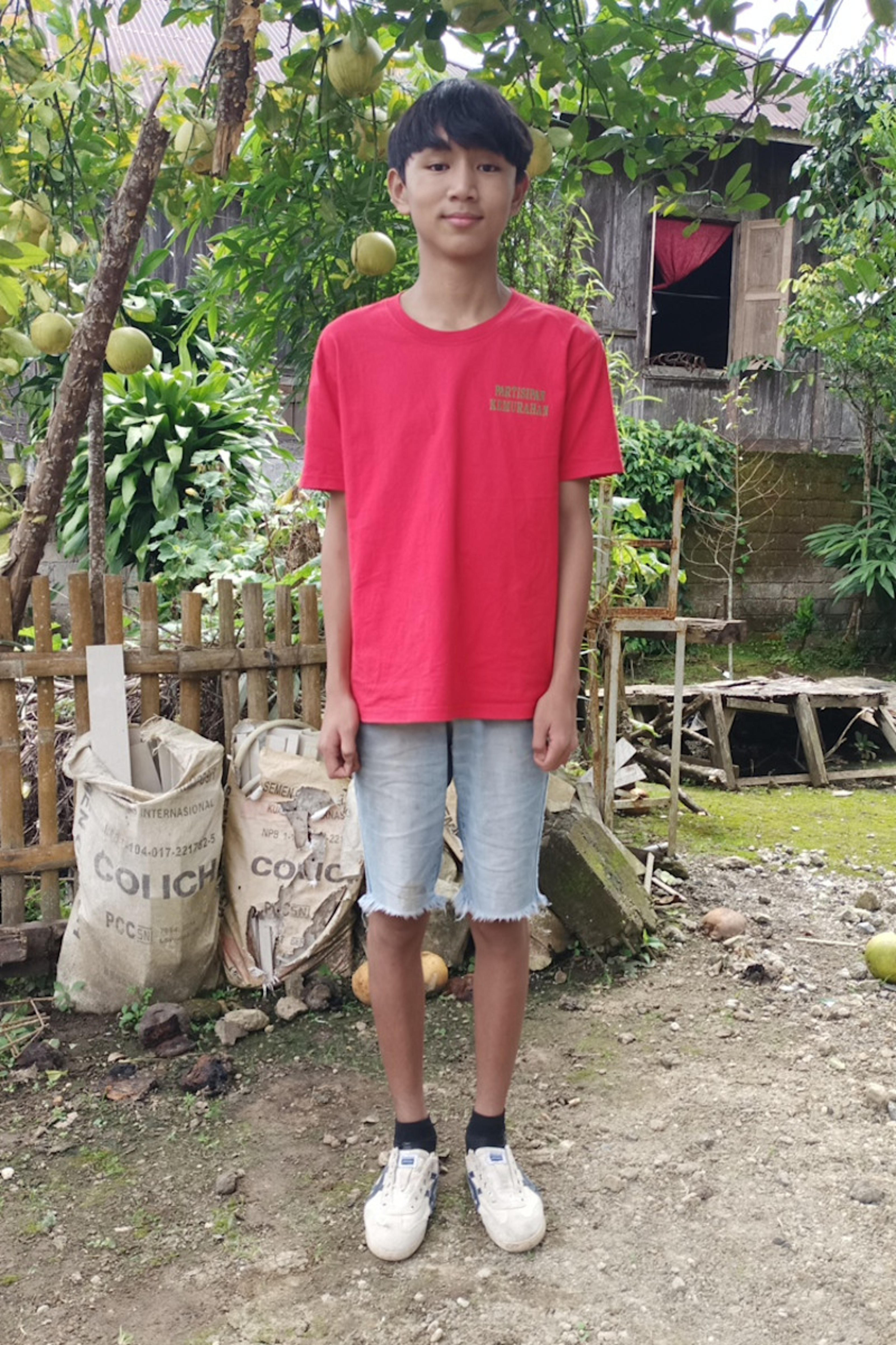 An unsponsored boy named Henoch from Indonesia who has waited 523 days for a sponsor.