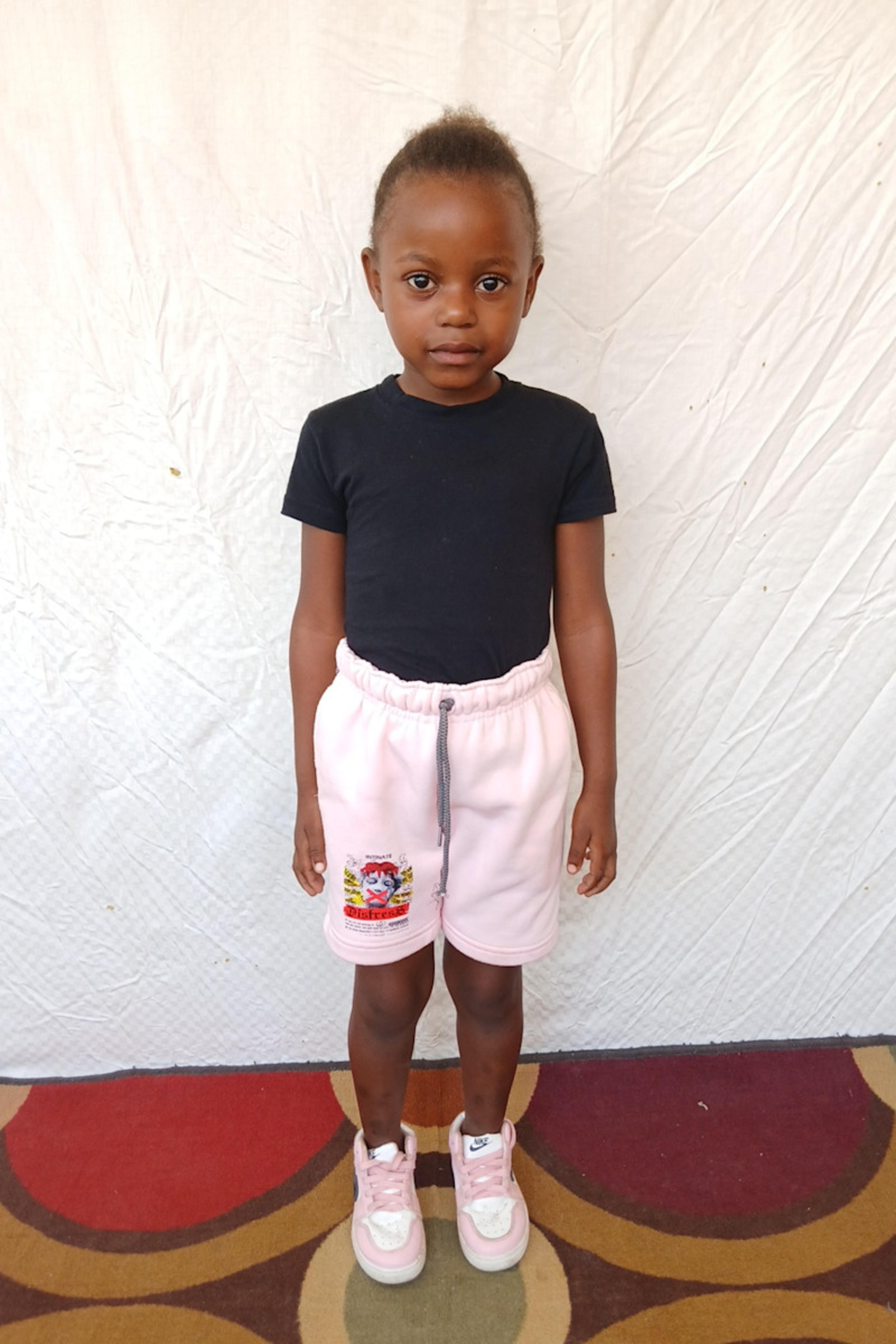 An unsponsored girl named Vanoo from Haiti who is vulnerable to exploitation and has waited 537 days for a sponsor.