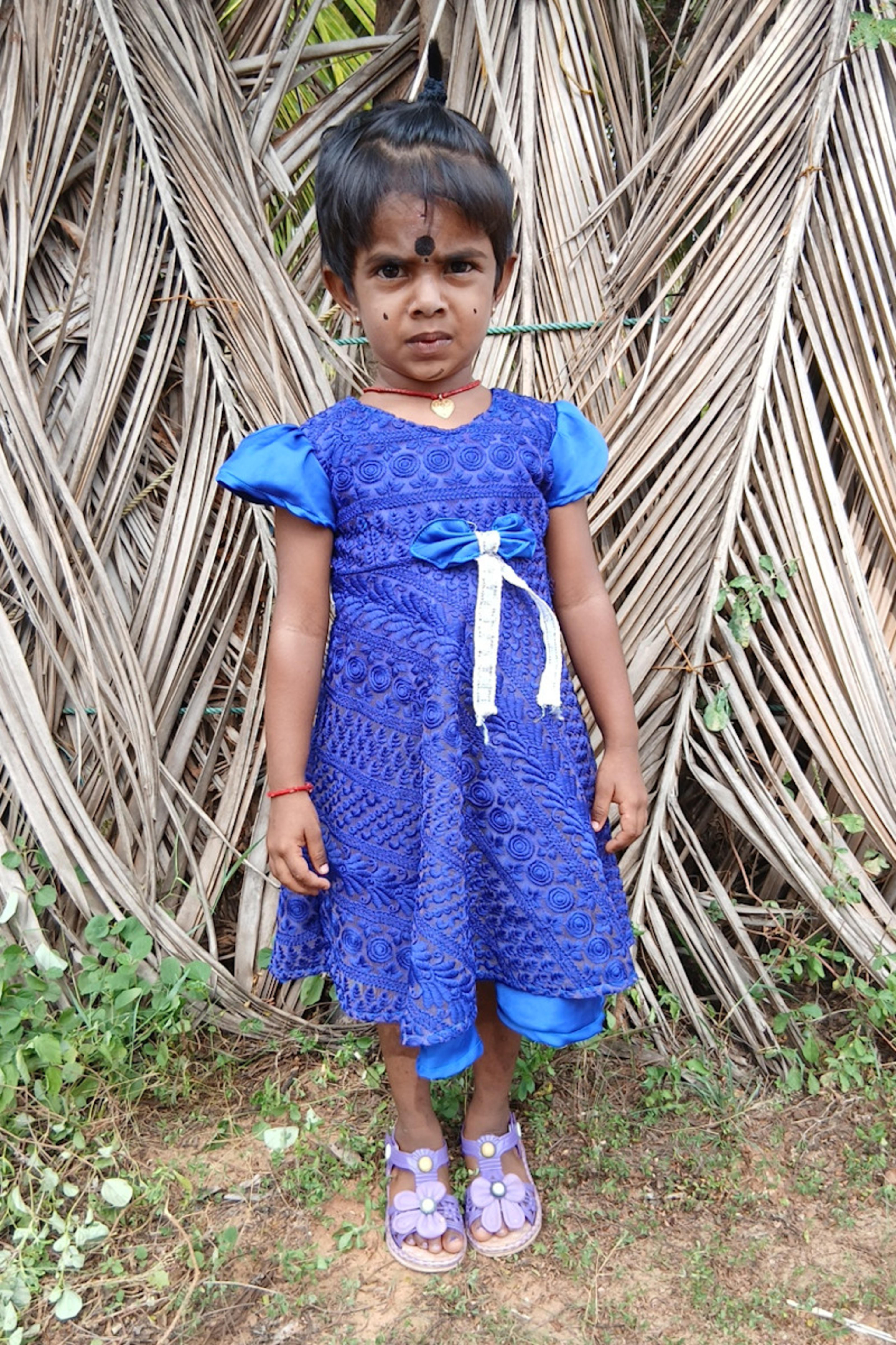 An unsponsored girl named Kapiksi from Sri Lanka who has waited 647 days for a sponsor.
