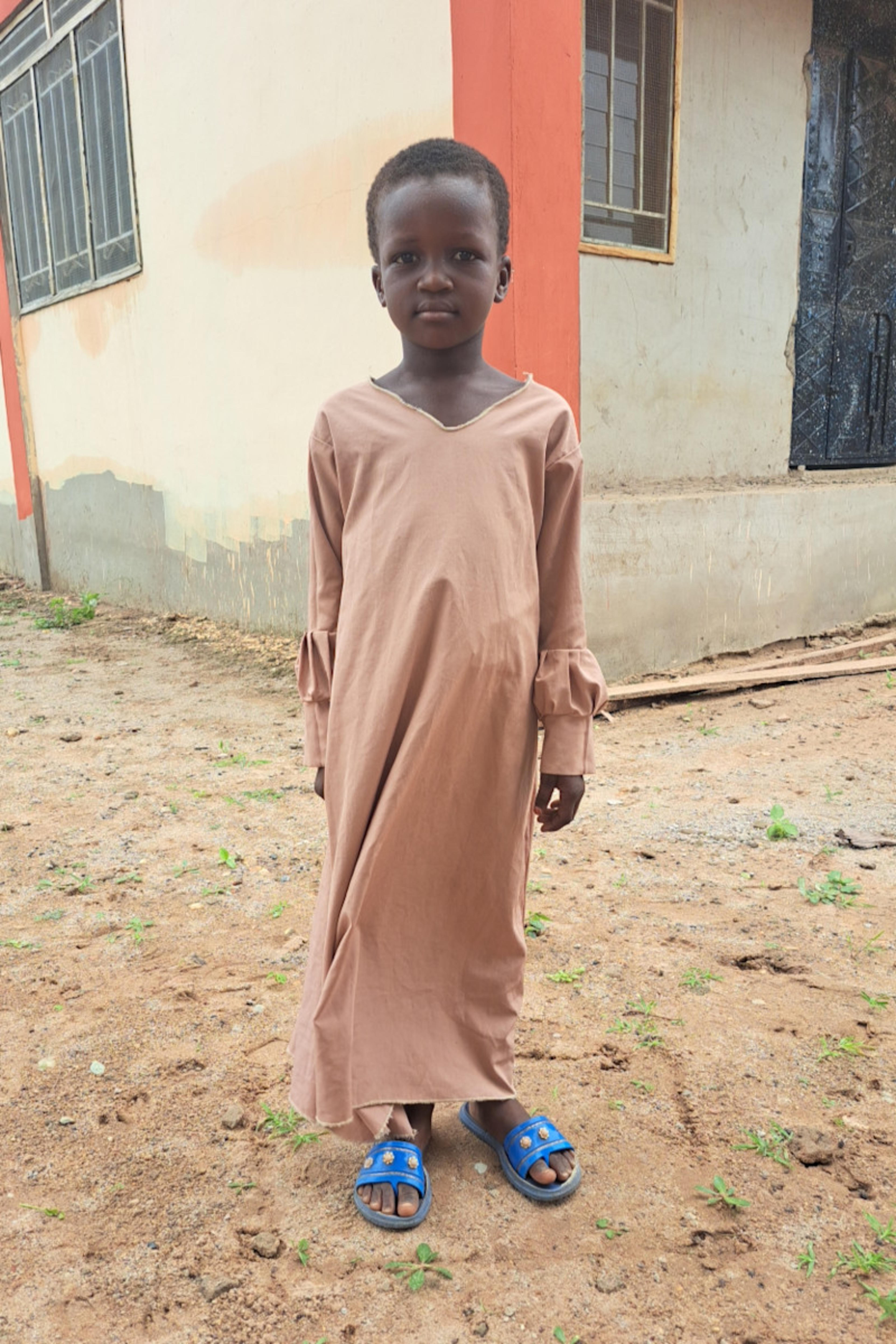 An unsponsored girl named Muklimatu from Ghana who lives in an AIDS-affected area and has waited 482 days for a sponsor.