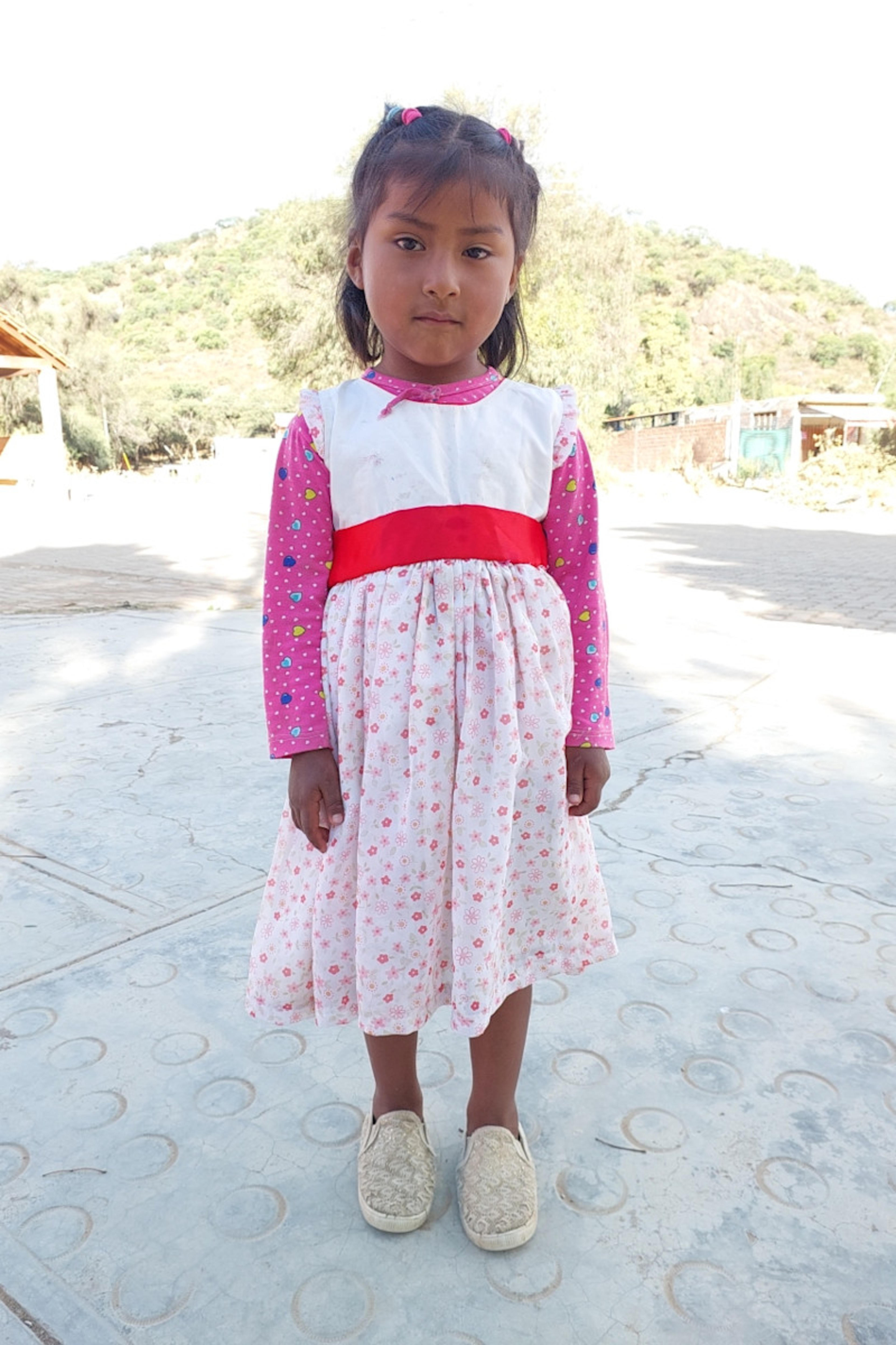 An unsponsored girl named Julia from Bolivia who has waited 460 days for a sponsor.