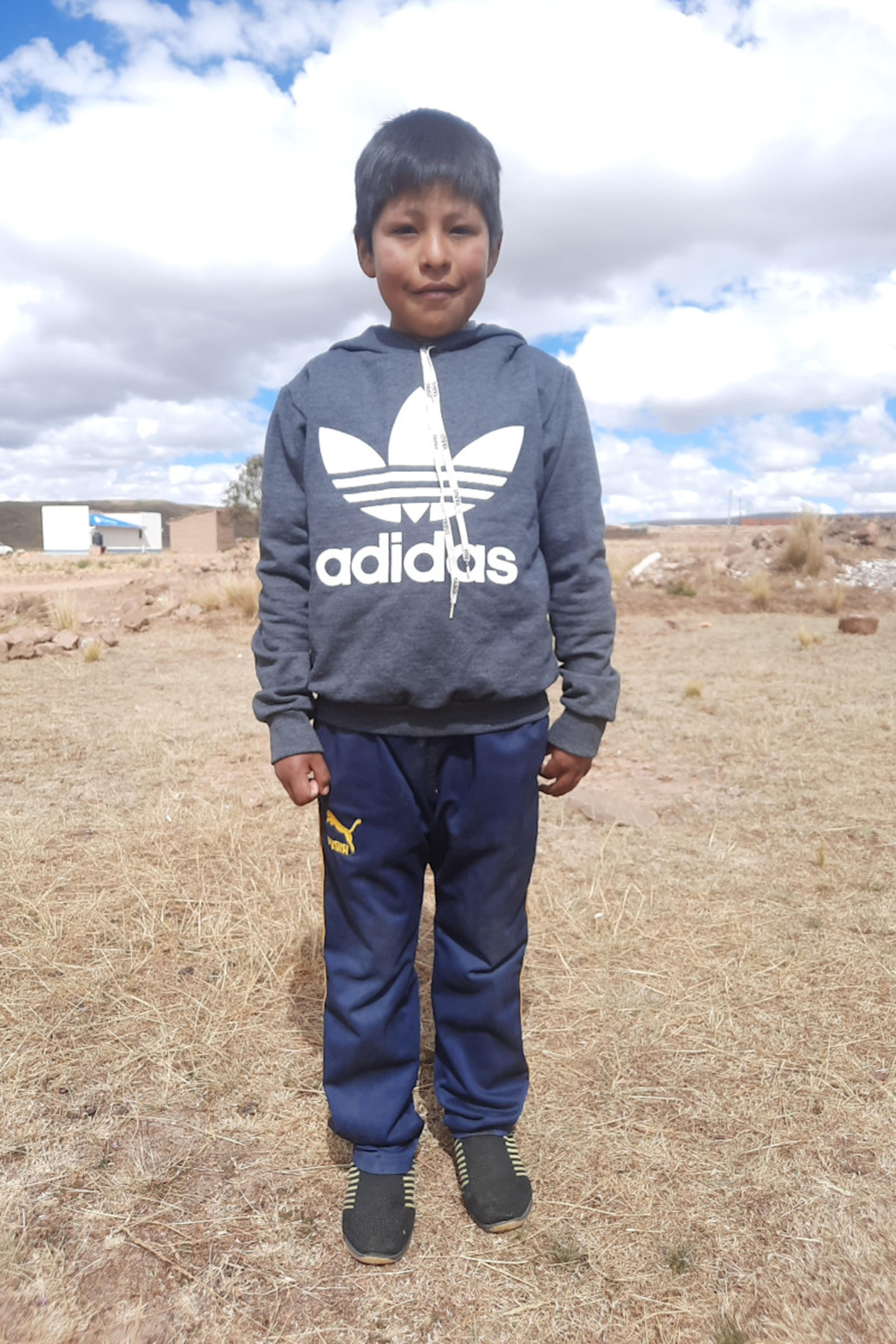 An unsponsored boy named Jhon from Bolivia who has waited 469 days for a sponsor.