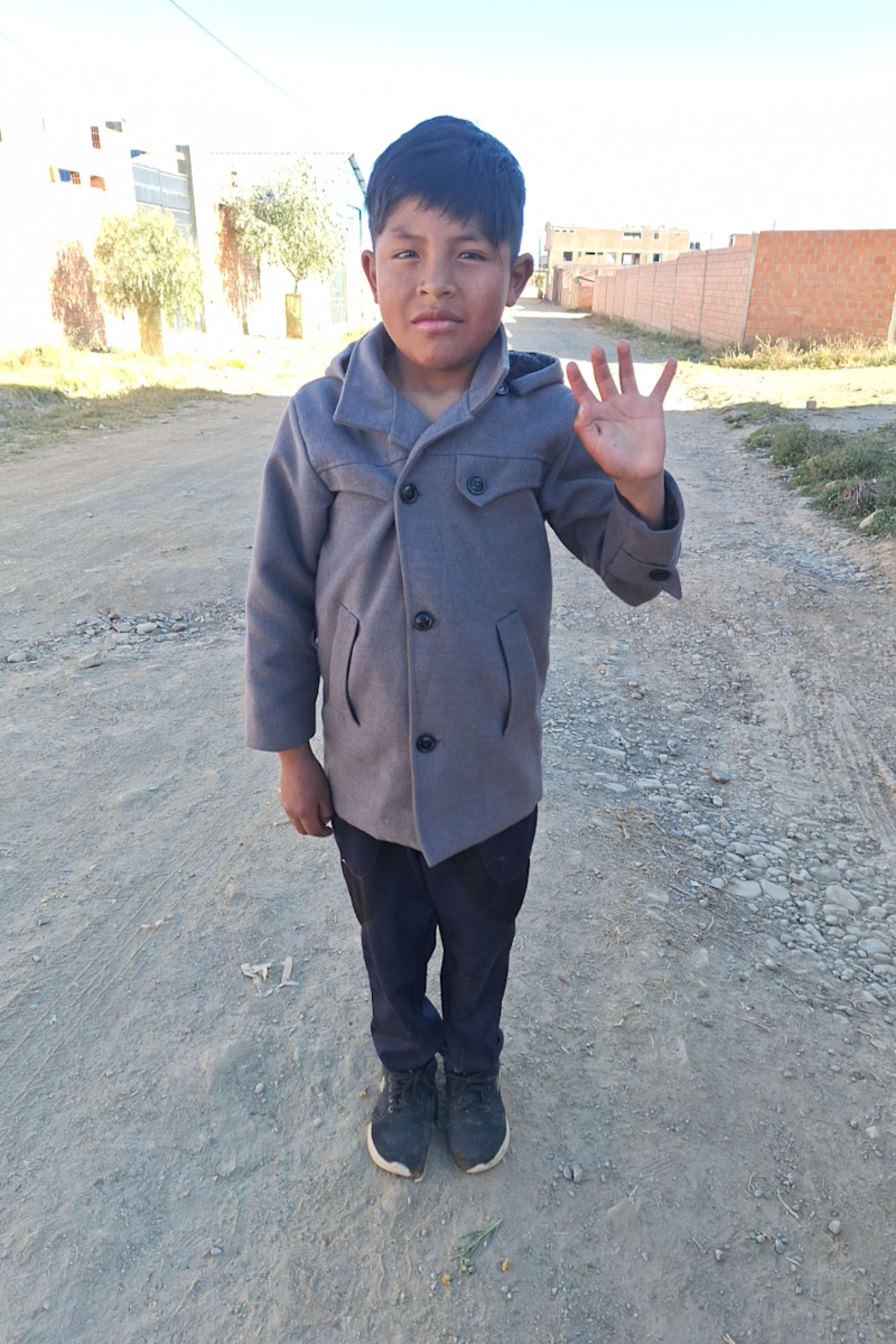 An unsponsored boy named Yuan from Bolivia who has waited 468 days for a sponsor.