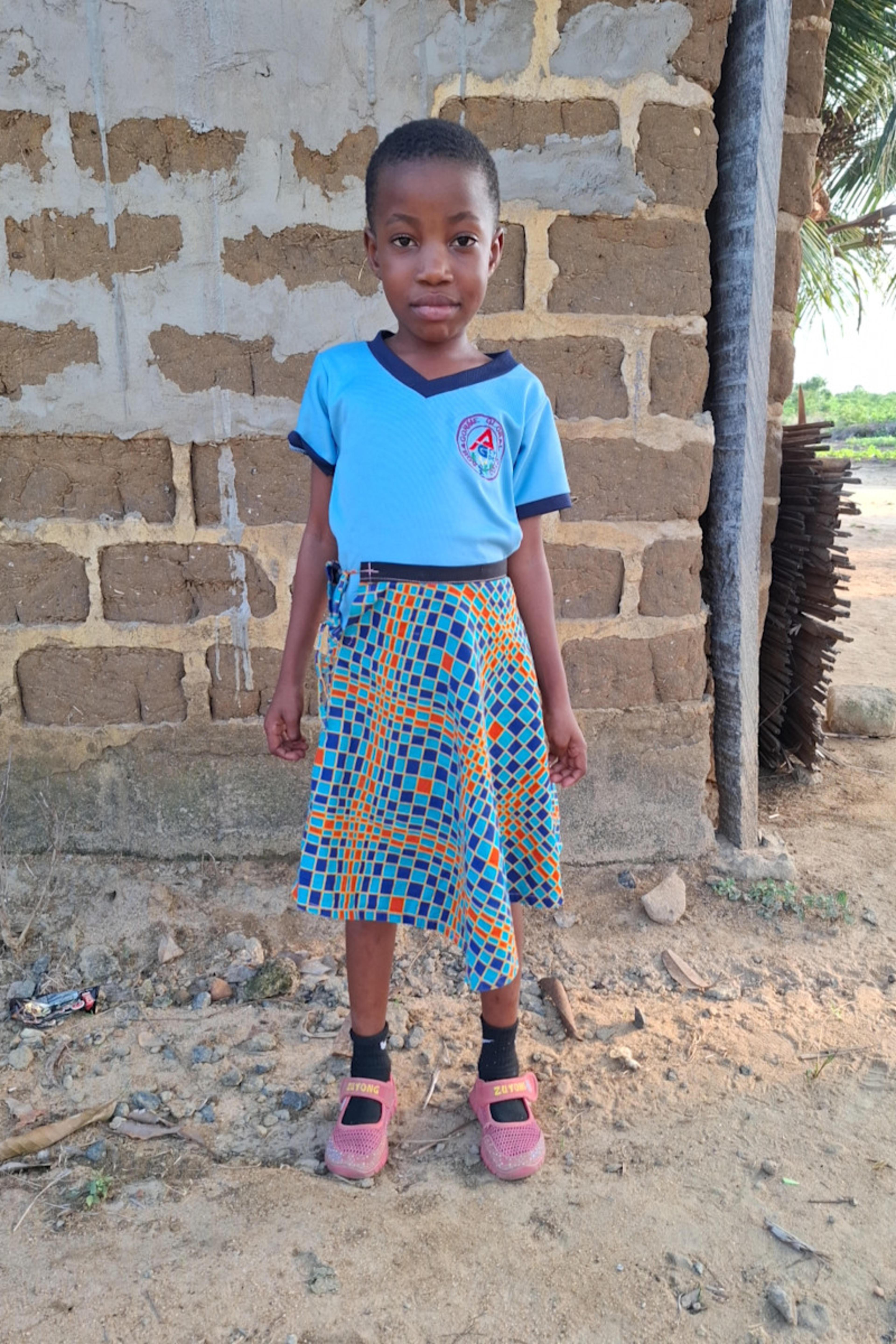 An unsponsored girl named Esiawonam from Ghana who lives in an AIDS-affected area and has waited 464 days for a sponsor.