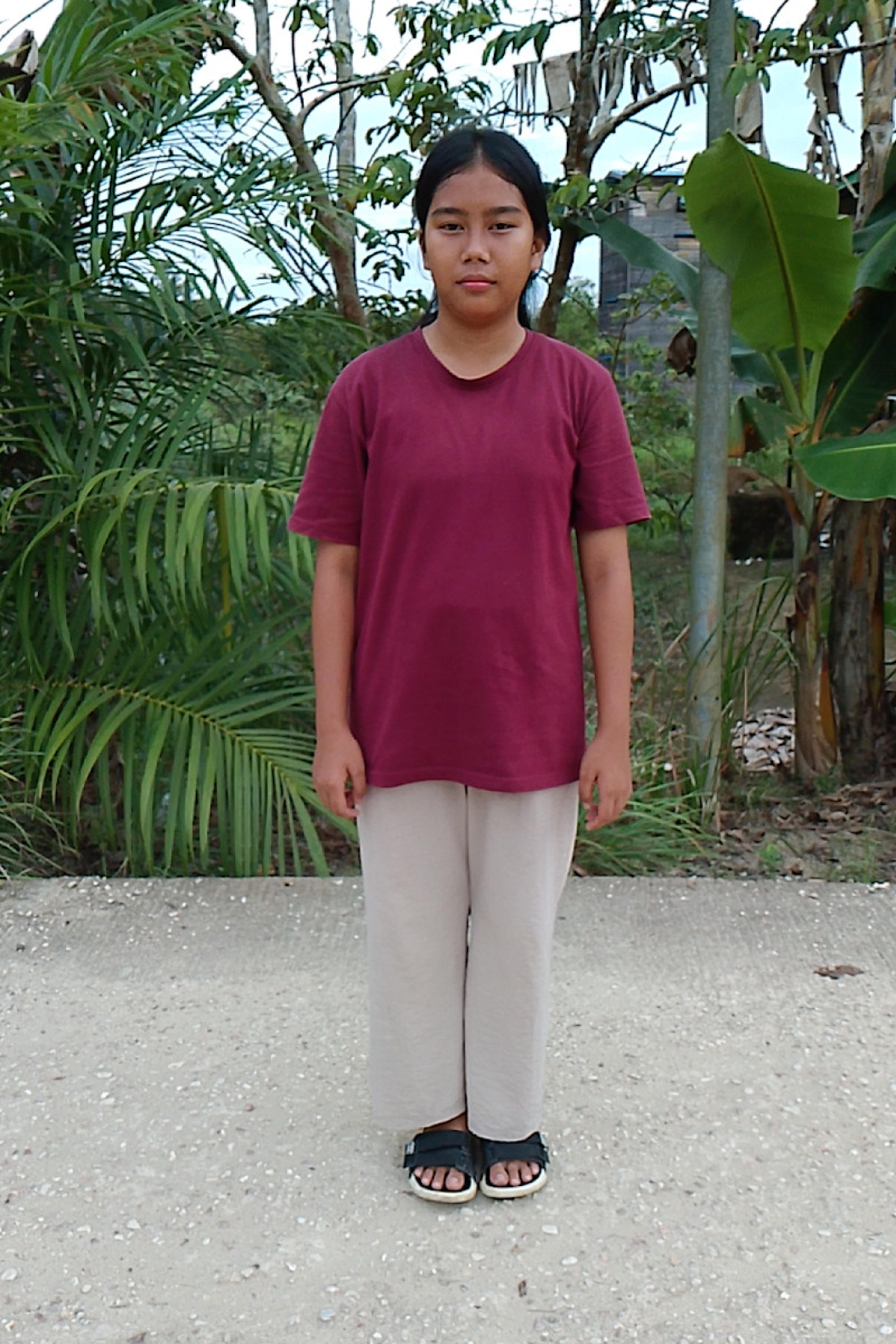 An unsponsored girl named Dewi from Indonesia who has waited 381 days for a sponsor.