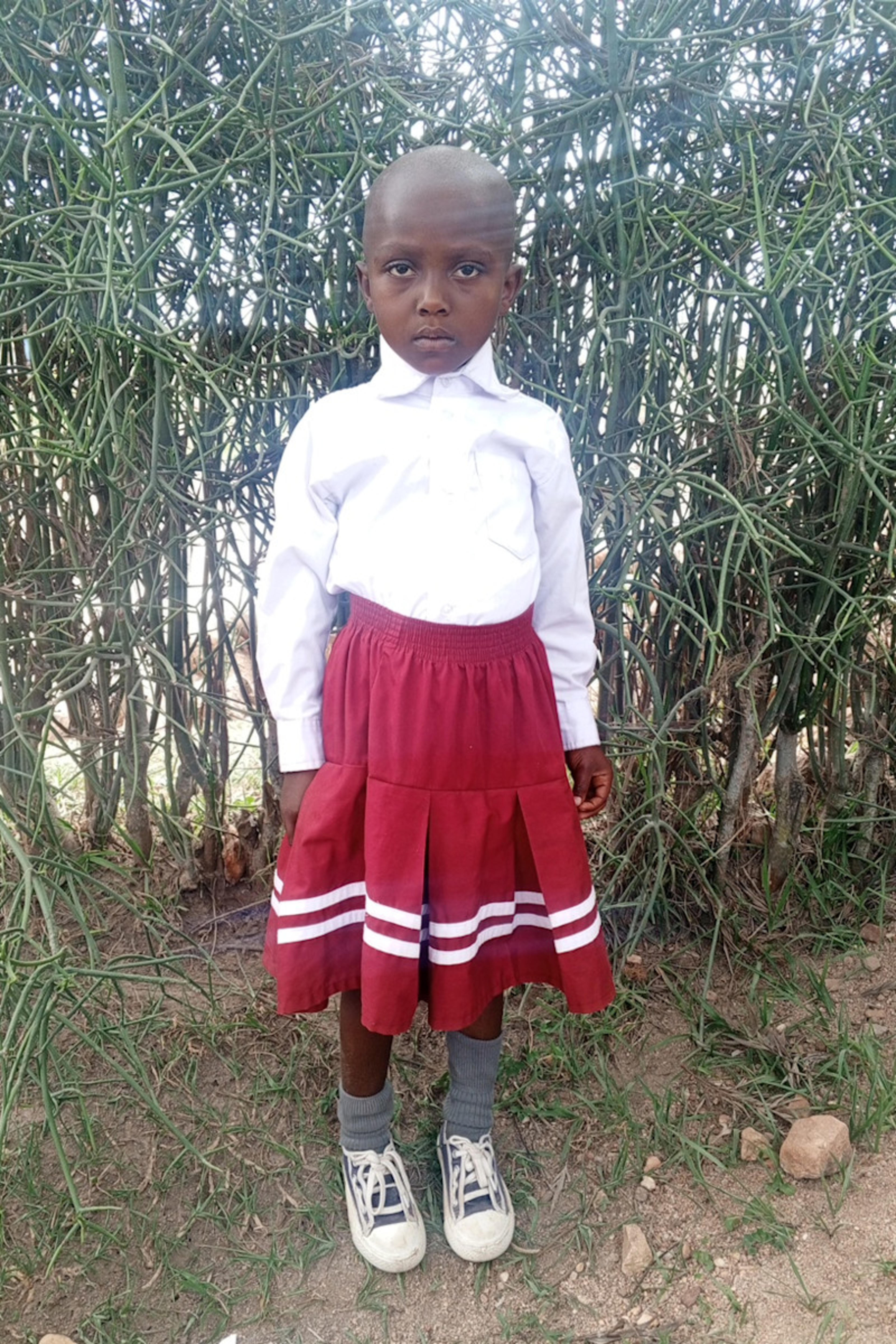 An unsponsored girl named Emeline from Rwanda who lives in an AIDS-affected area, is vulnerable to exploitation and has waited 322 days for a sponsor.