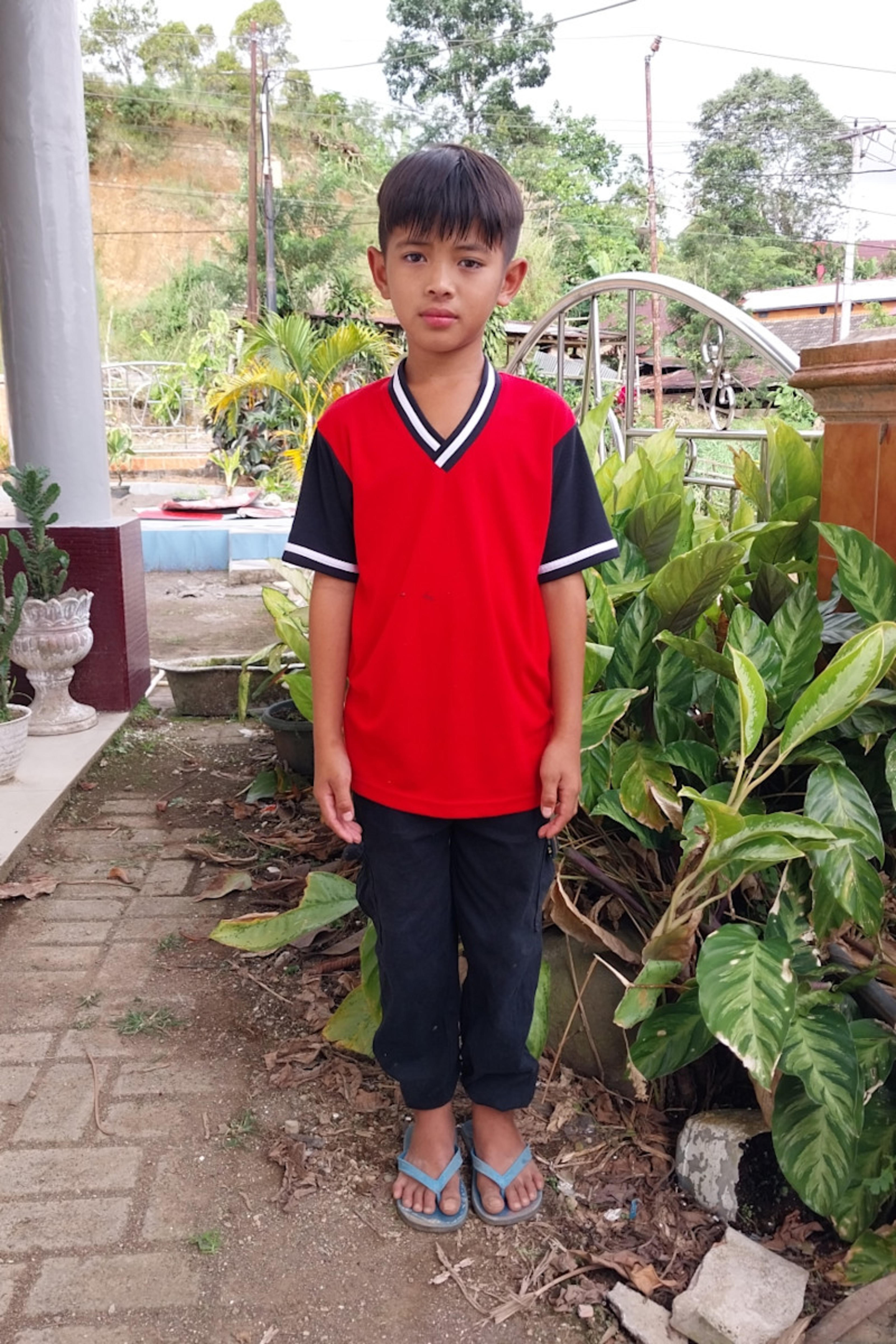 An unsponsored boy named Chiro from Indonesia who has waited 682 days for a sponsor.