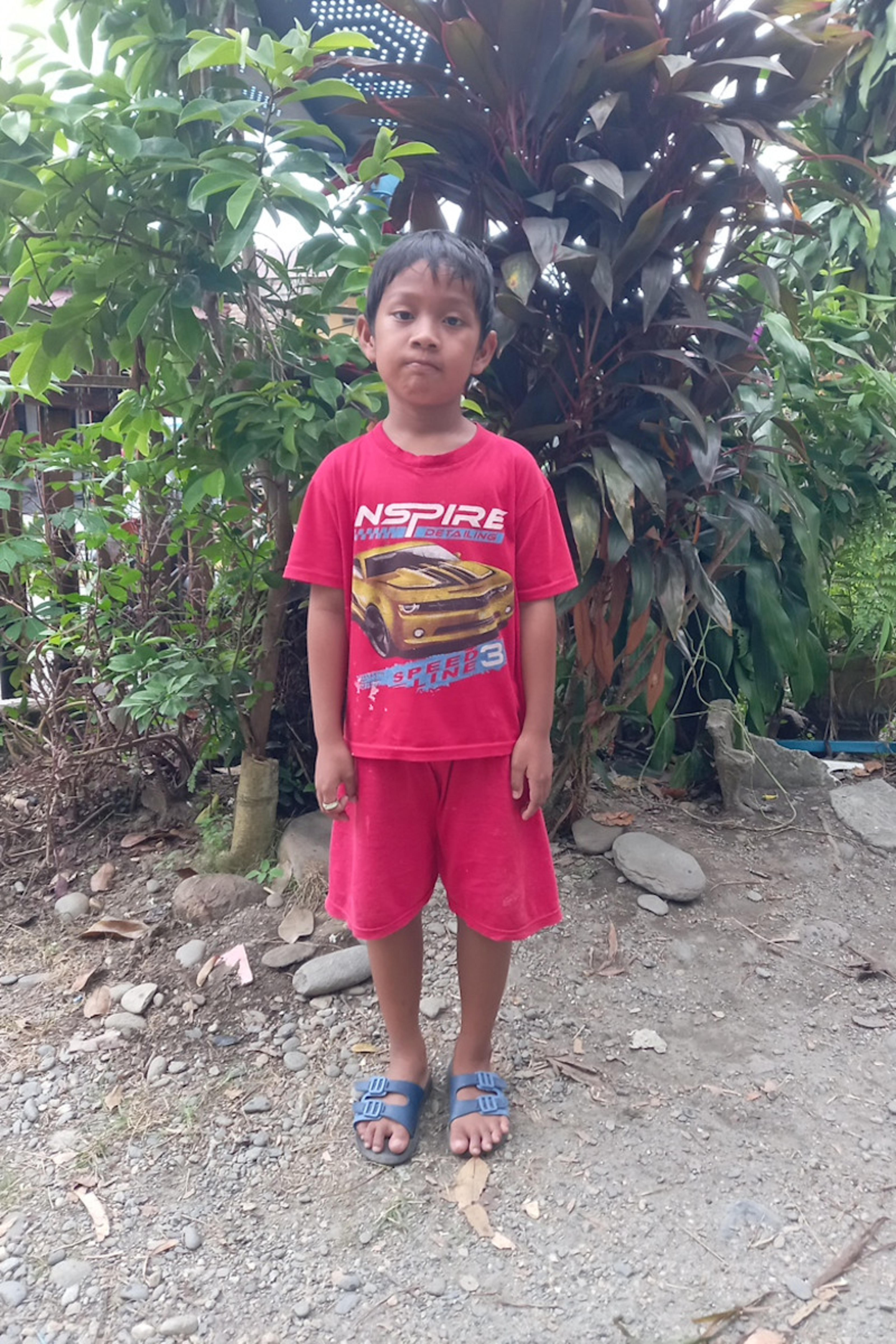An unsponsored boy named Aza from Indonesia who has waited 587 days for a sponsor.