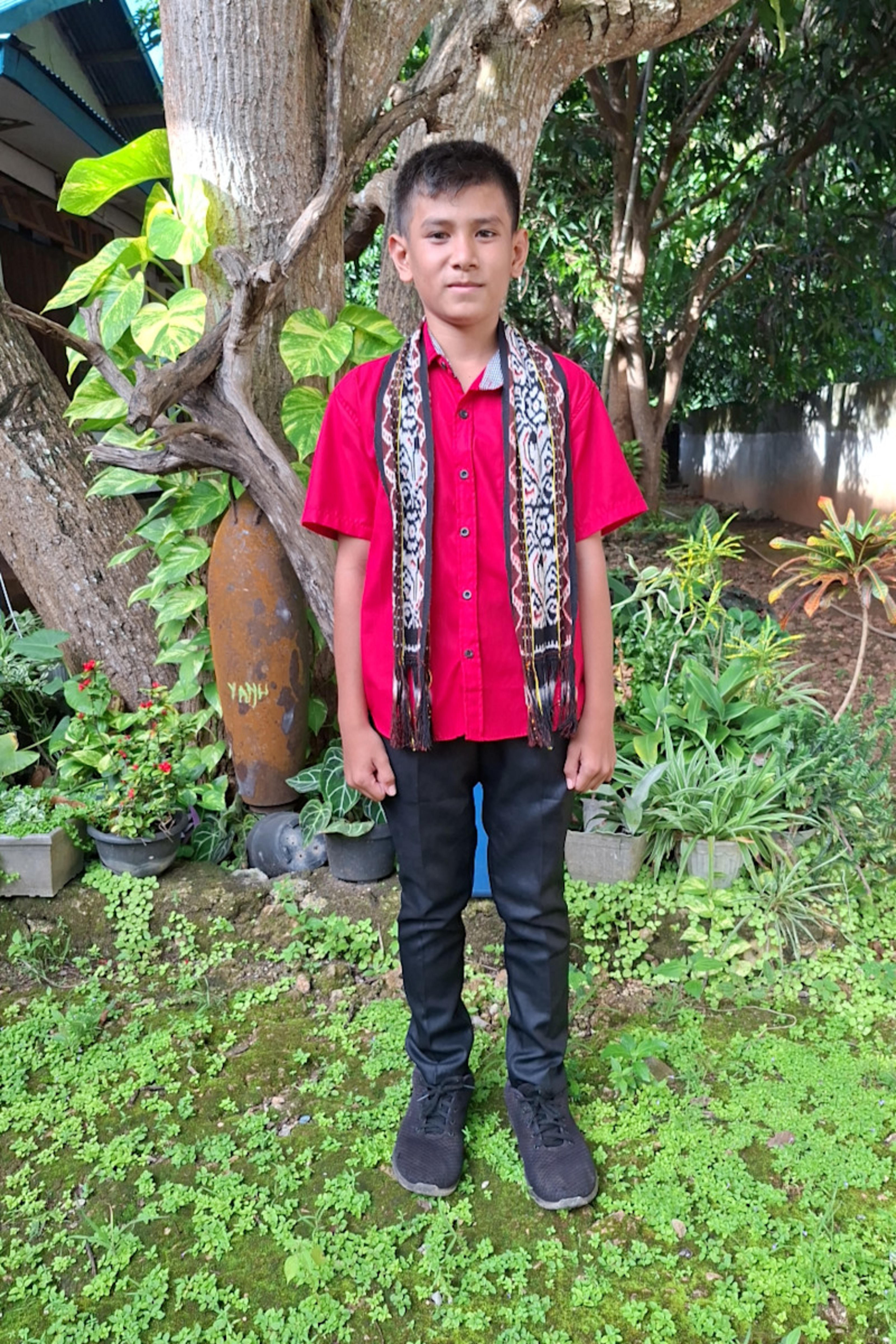 An unsponsored boy named Micky from Indonesia who has waited 467 days for a sponsor.