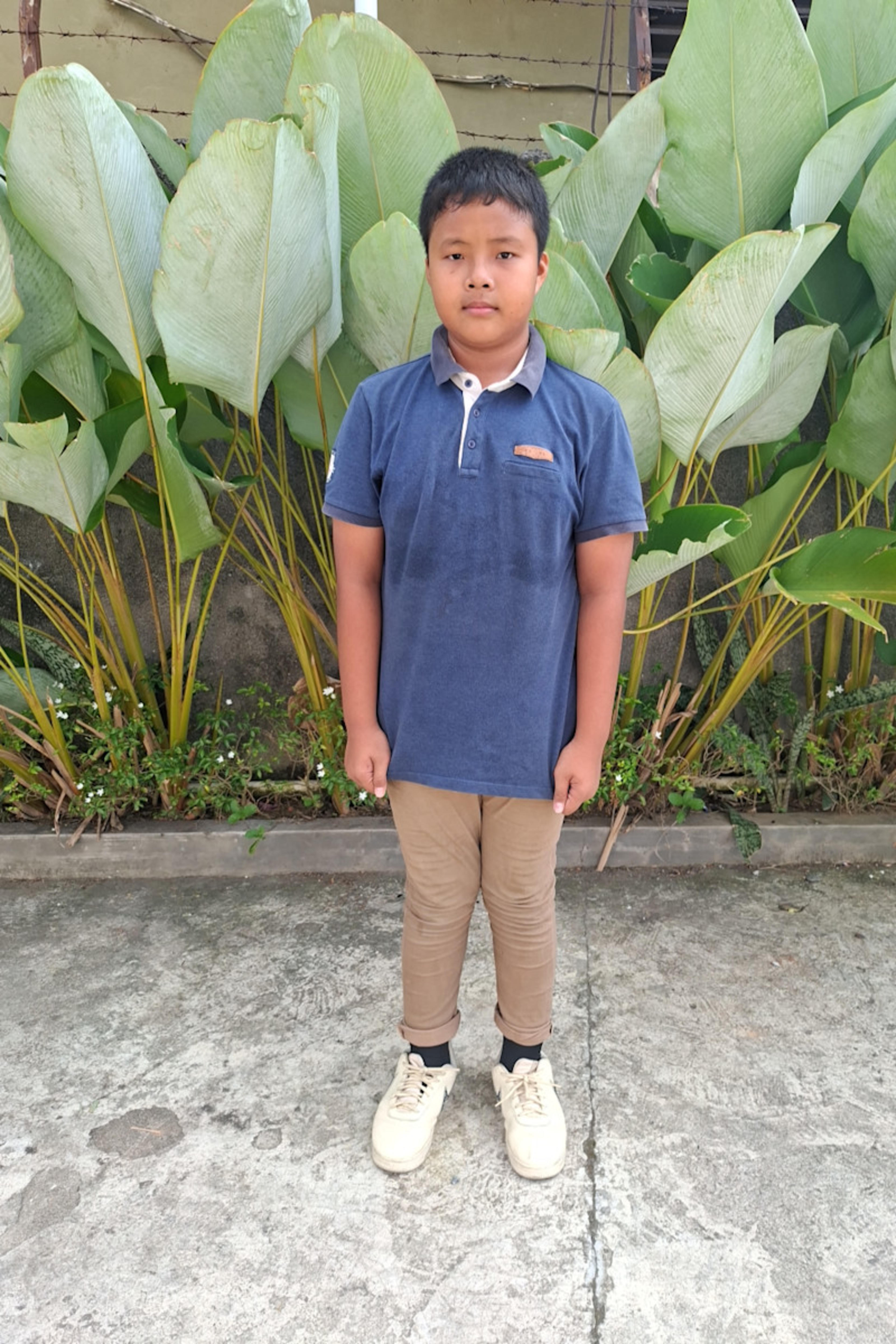An unsponsored boy named Gilbert from Indonesia who has waited 596 days for a sponsor.