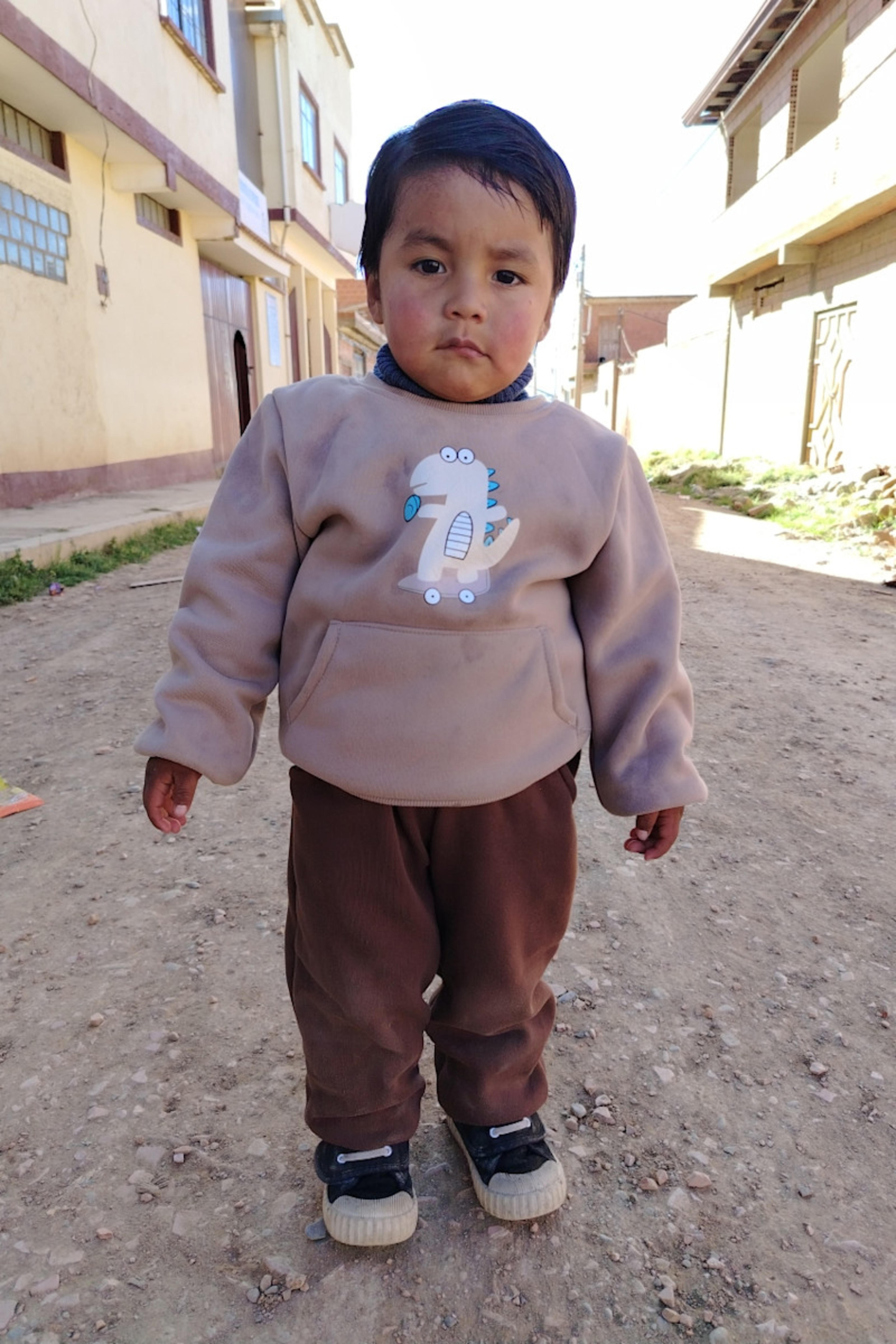 An unsponsored boy named Eydan from Bolivia who has waited 676 days for a sponsor.