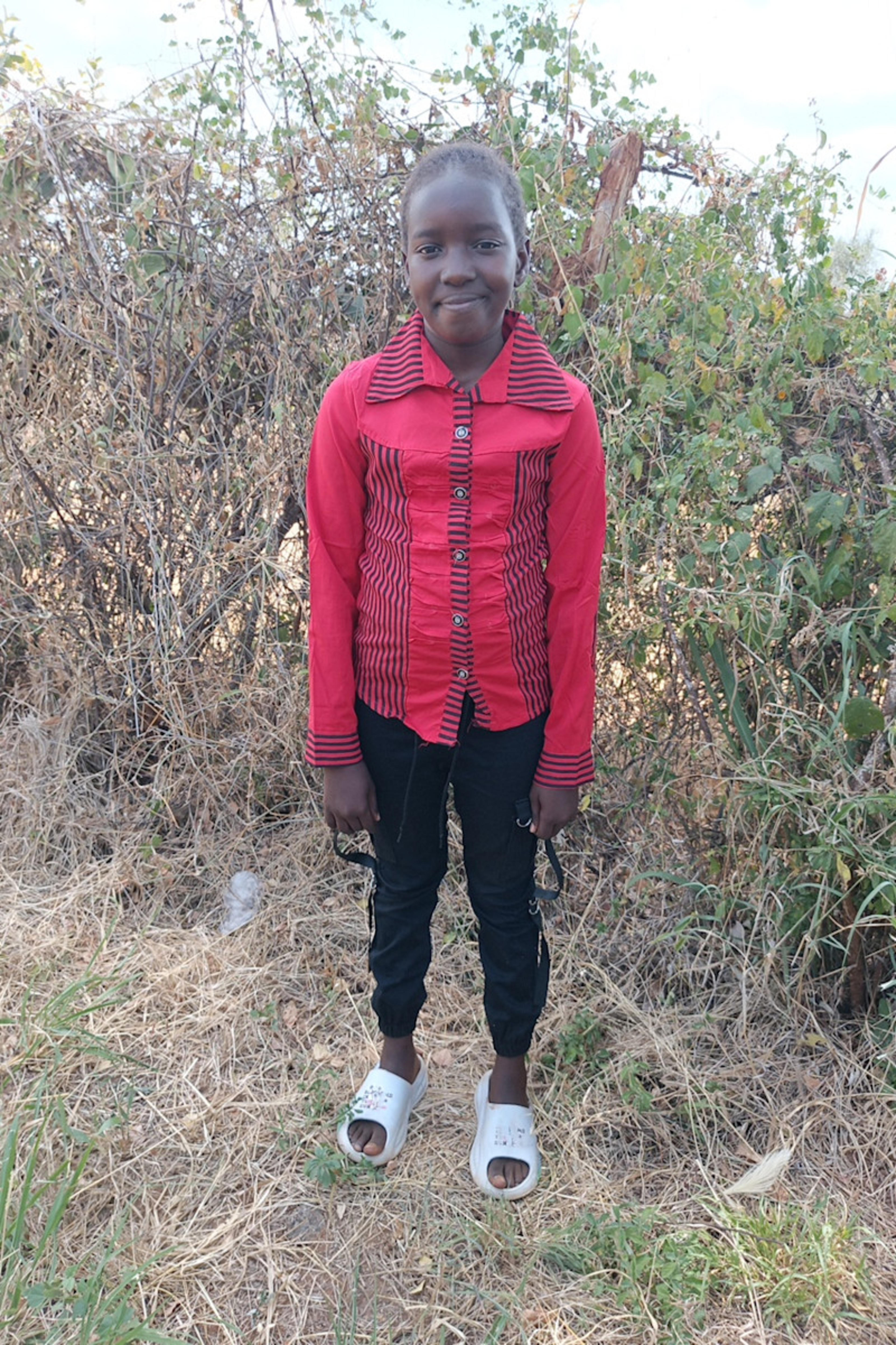 An unsponsored girl named Moreen from Kenya who lives in an AIDS-affected area and has waited 346 days for a sponsor.