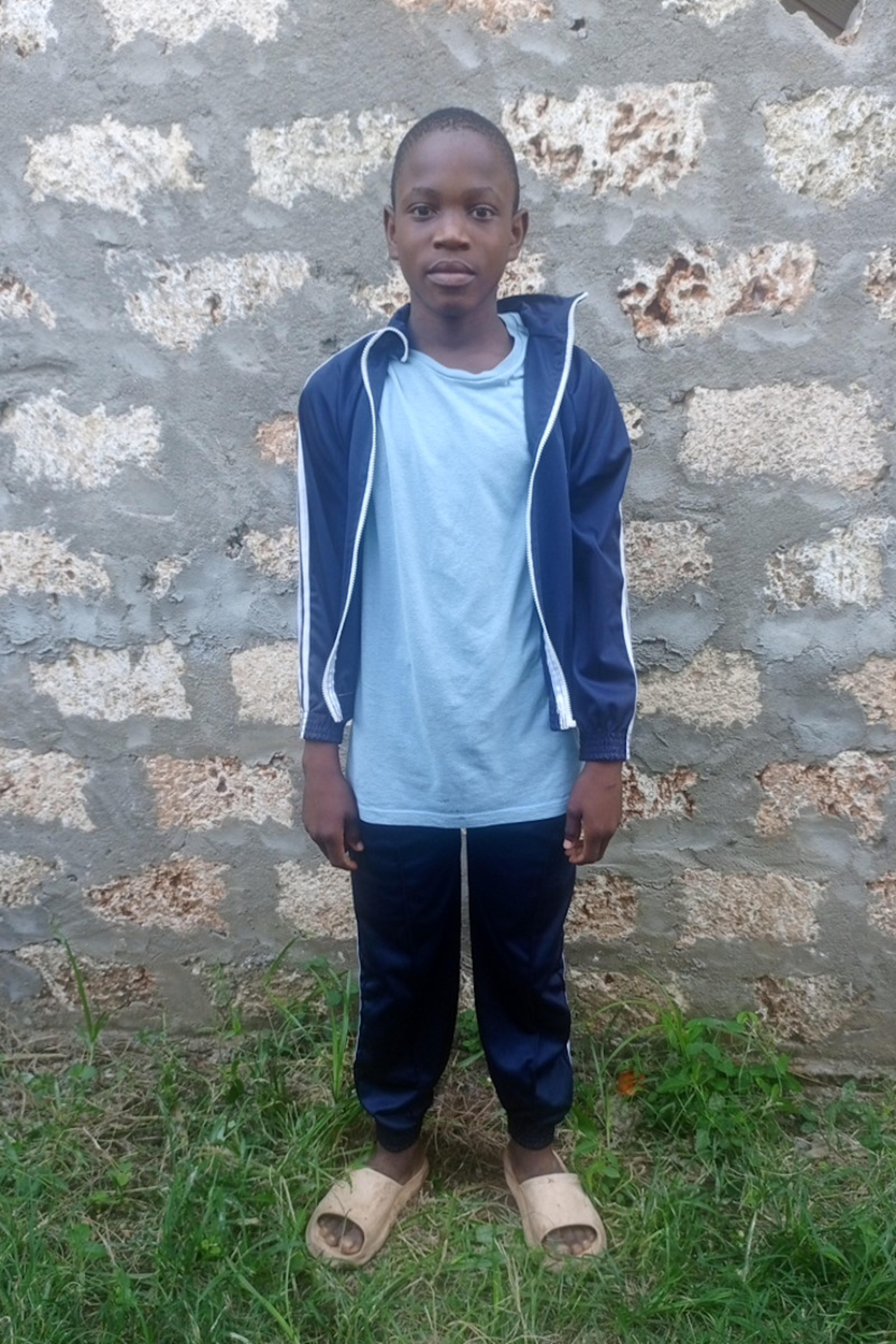 An unsponsored boy named Thoya from Kenya who lives in an AIDS-affected area and has waited 467 days for a sponsor.