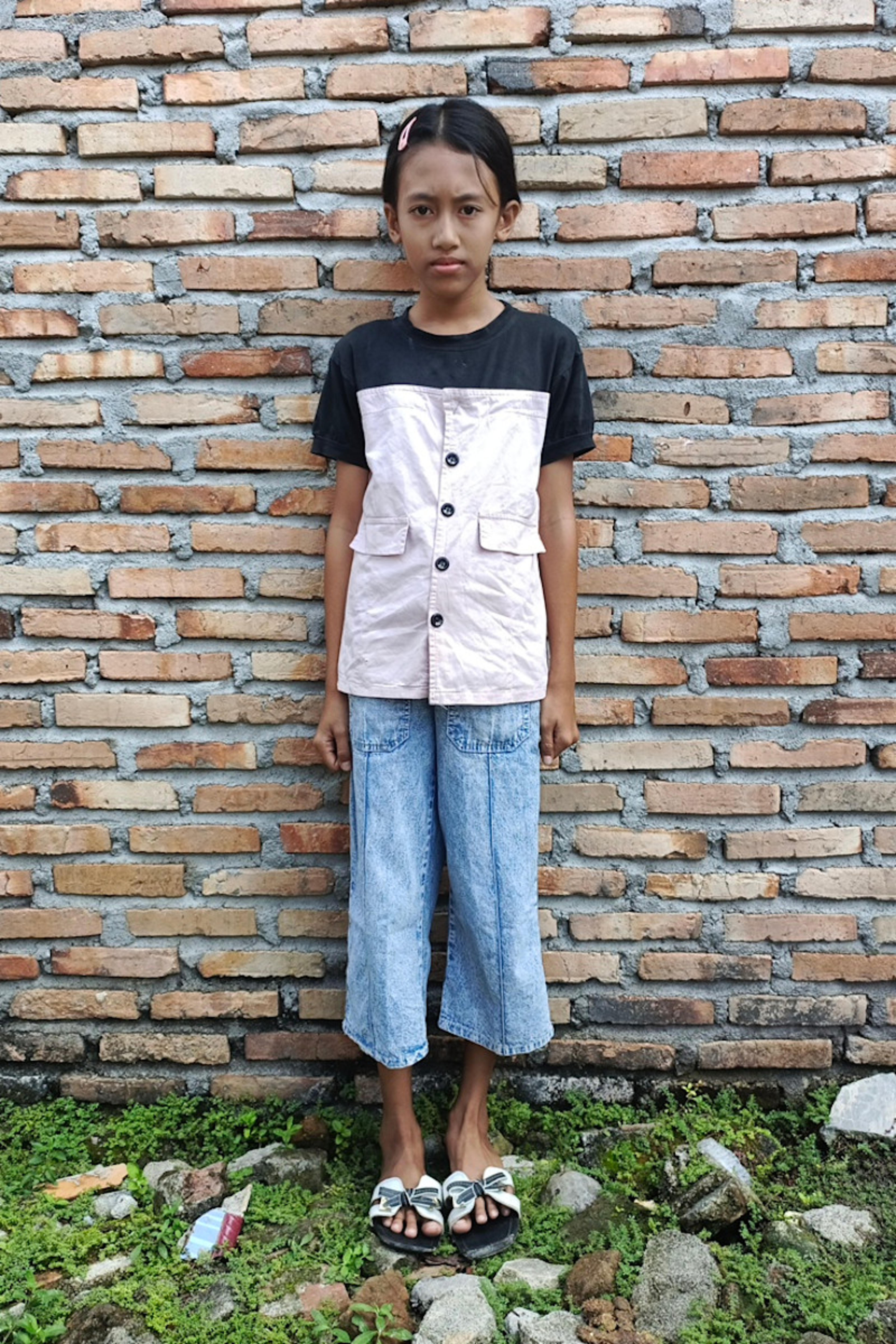 An unsponsored girl named Eliana from Indonesia who has waited 530 days for a sponsor.