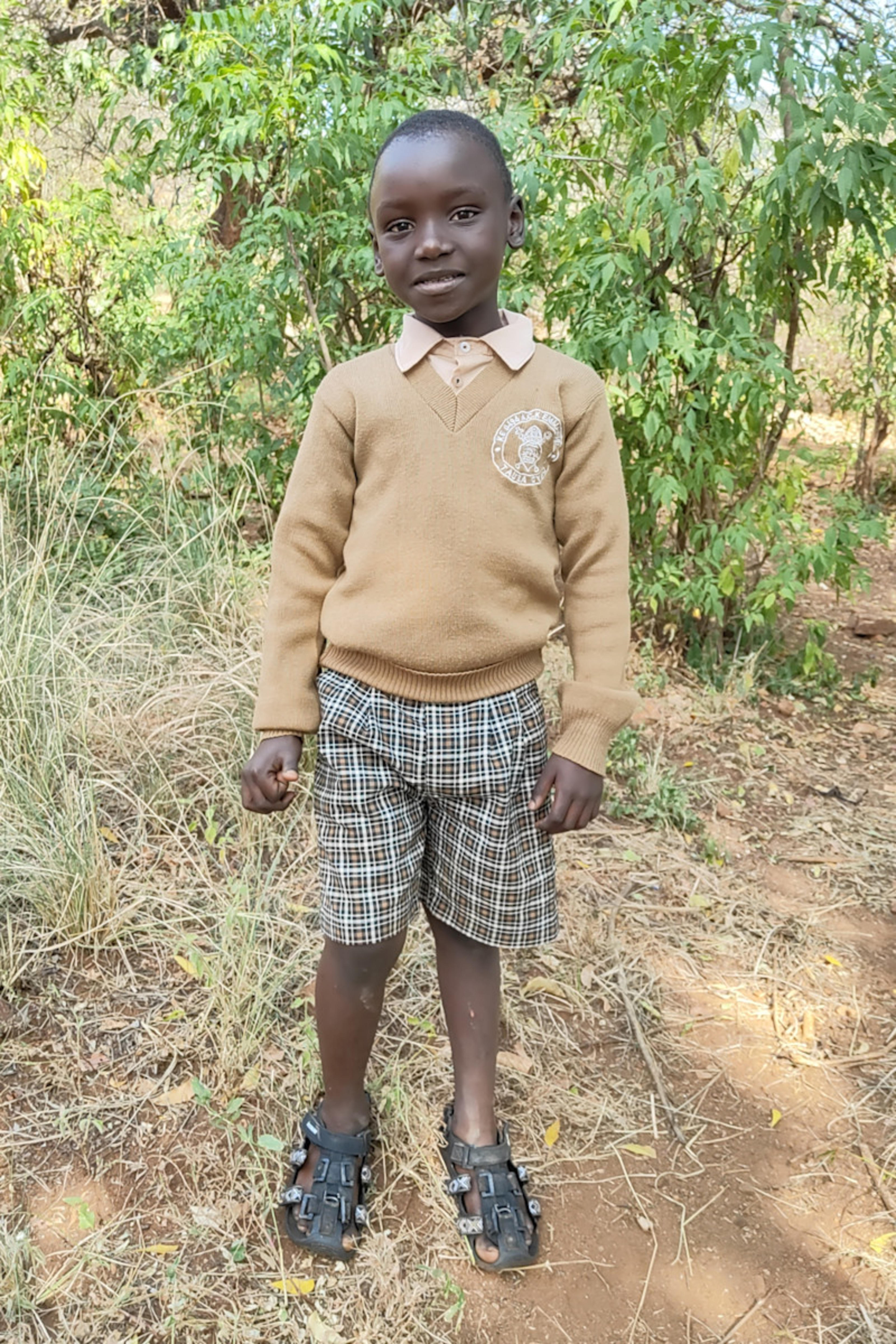 An unsponsored boy named Mwambi from Kenya who lives in an AIDS-affected area and has waited 662 days for a sponsor.