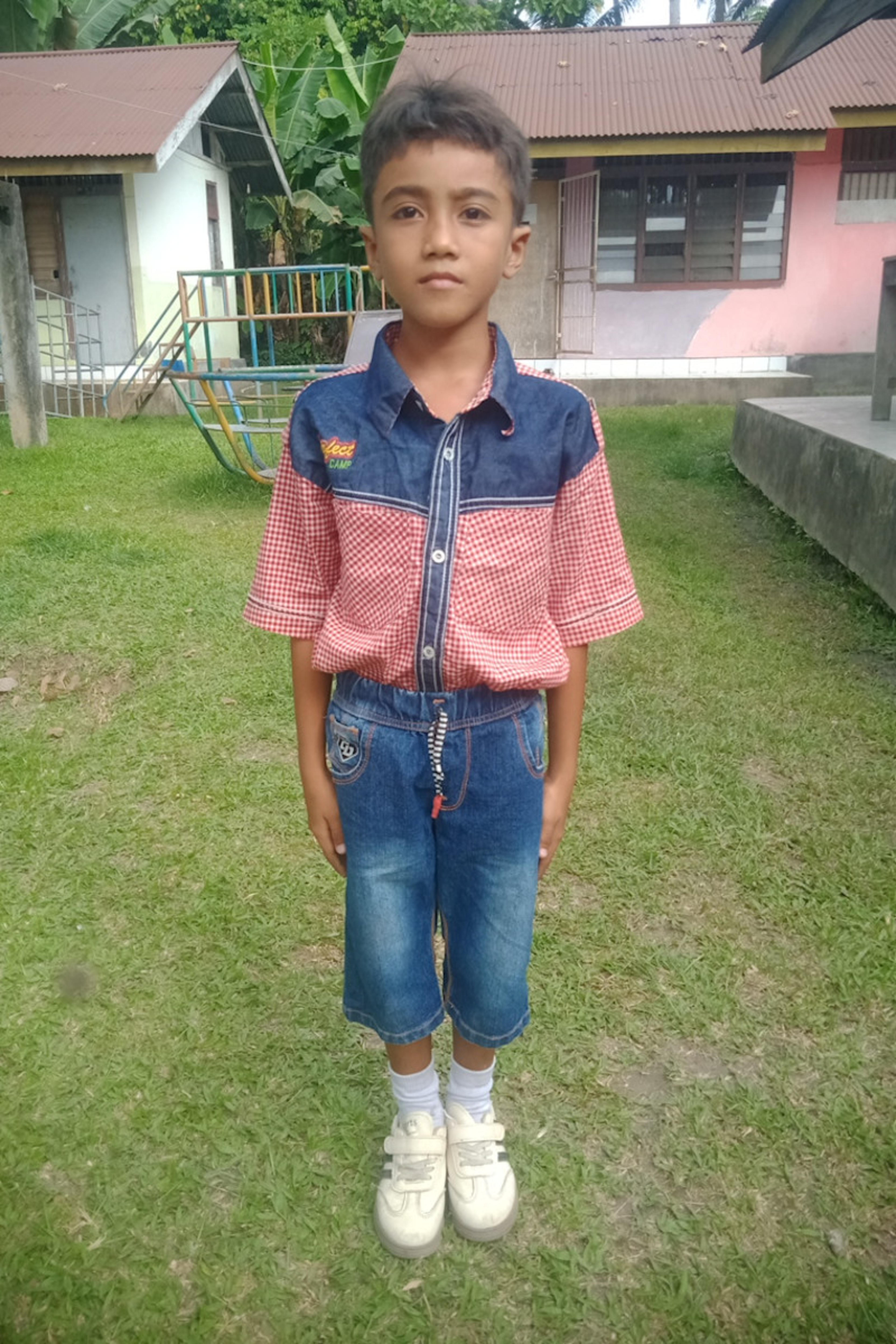 An unsponsored boy named Kris from Indonesia who has waited 471 days for a sponsor.