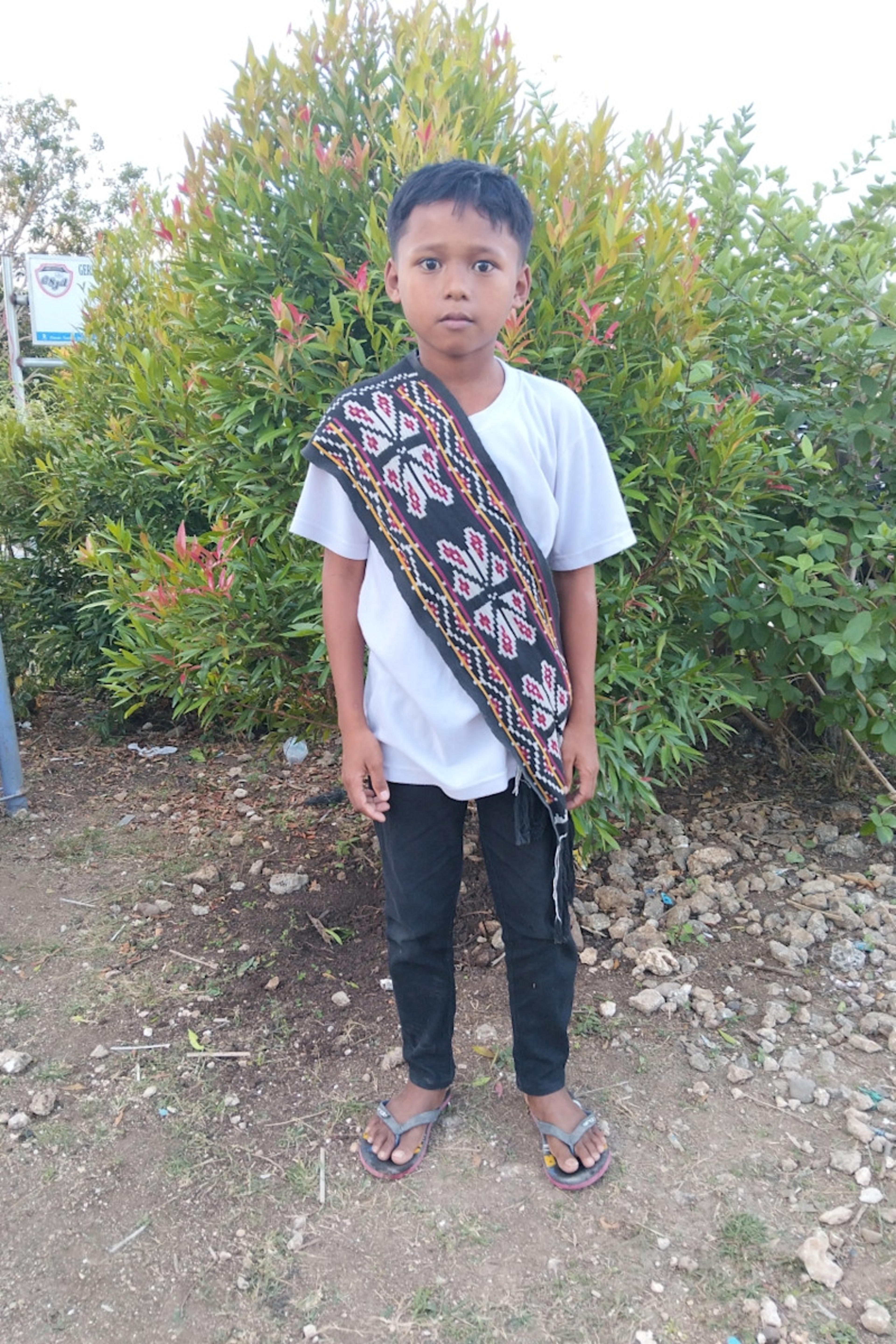 An unsponsored boy named Falen from Indonesia who has waited 599 days for a sponsor.