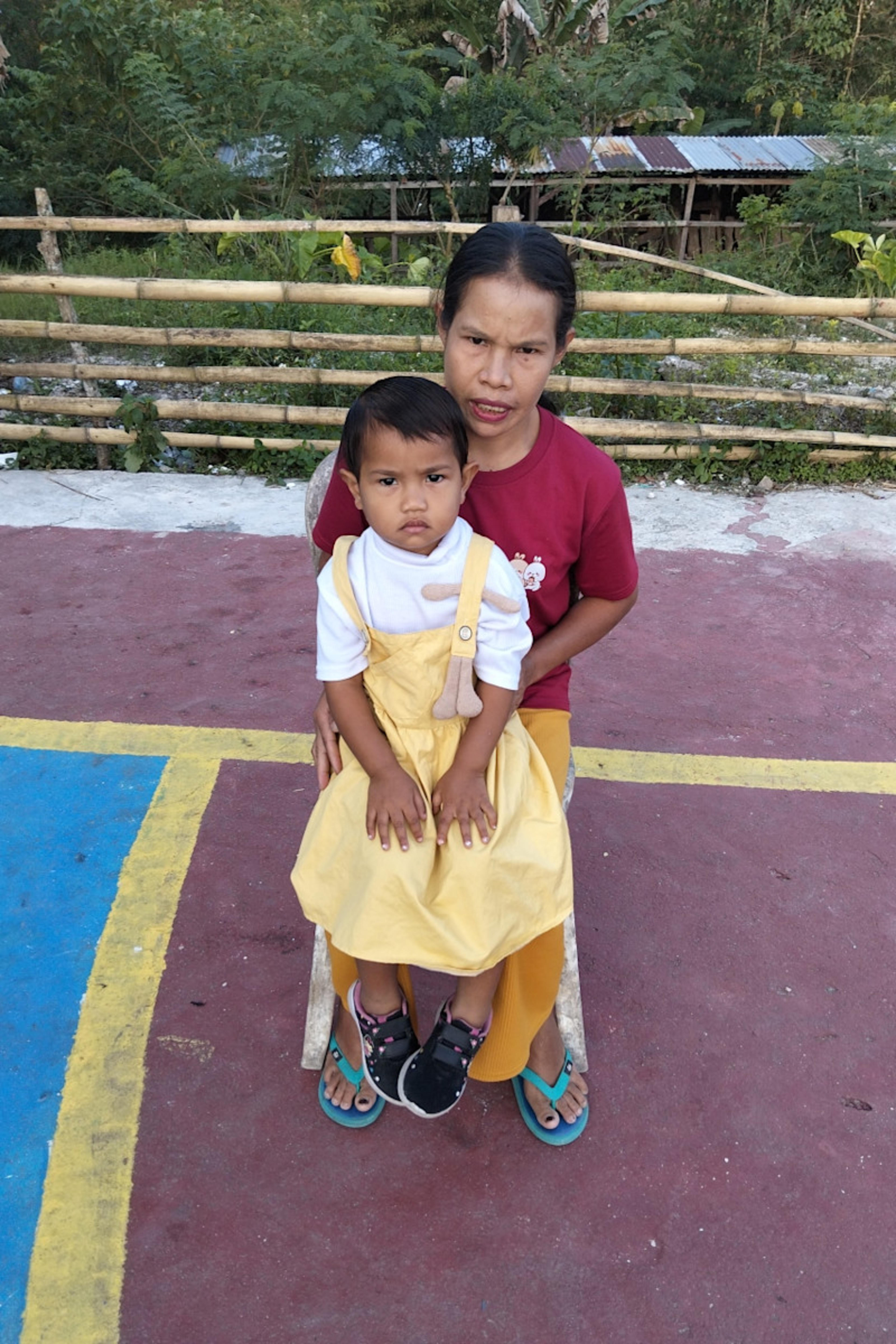 An unsponsored girl named Dian from Indonesia who has waited 596 days for a sponsor.