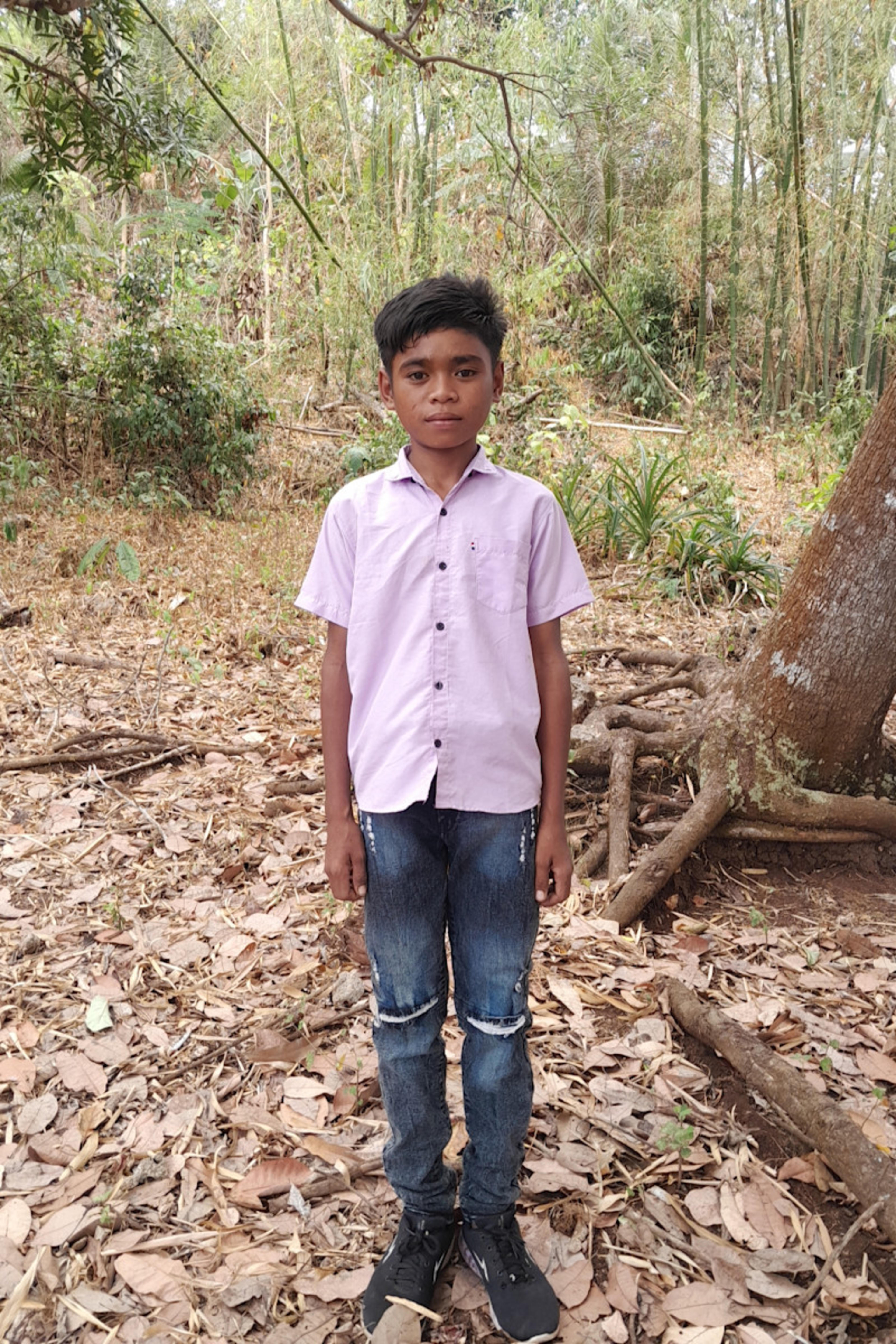 An unsponsored boy named Fian from Indonesia who has waited 590 days for a sponsor.