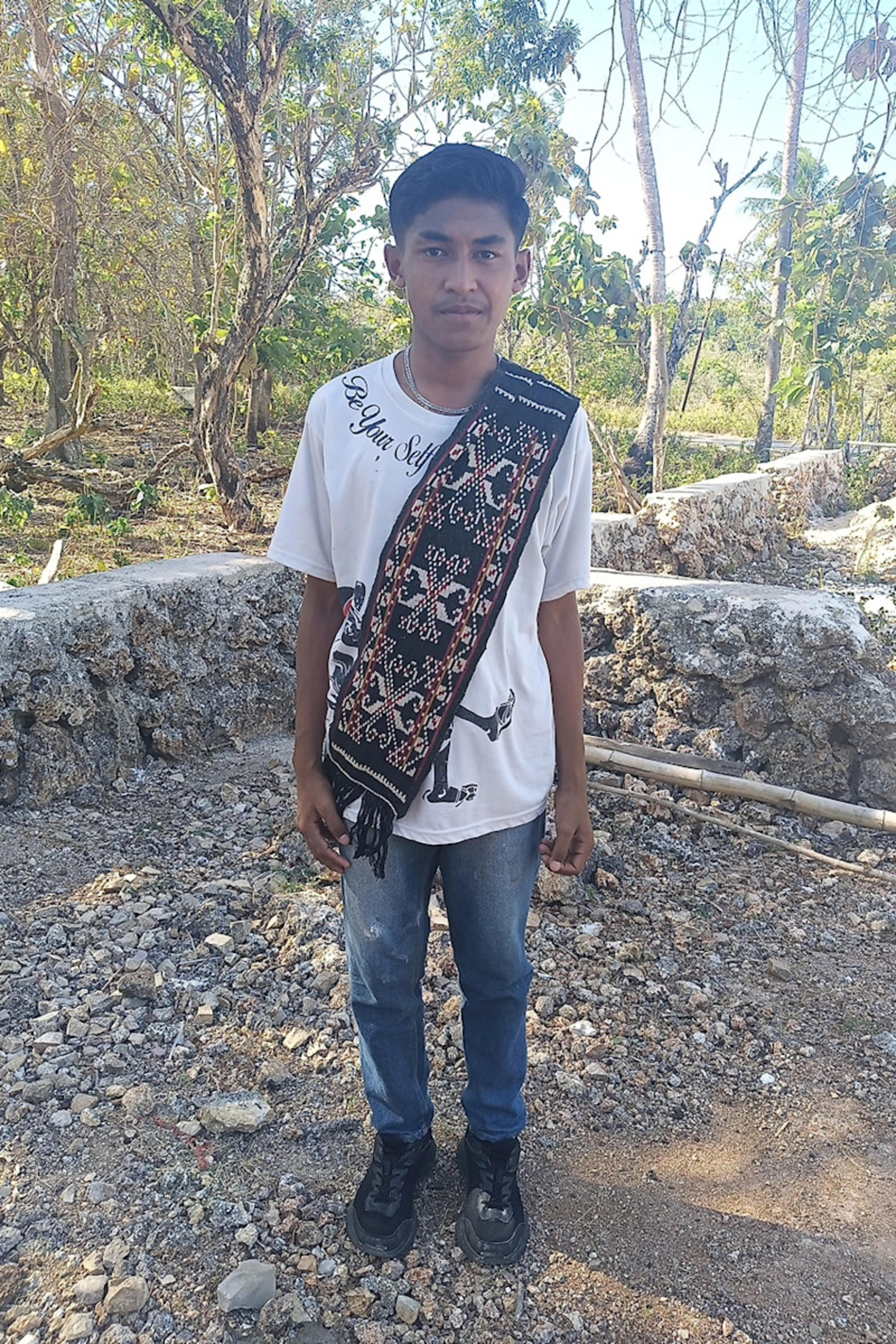 An unsponsored boy named Bayu from Indonesia who has waited 371 days for a sponsor.