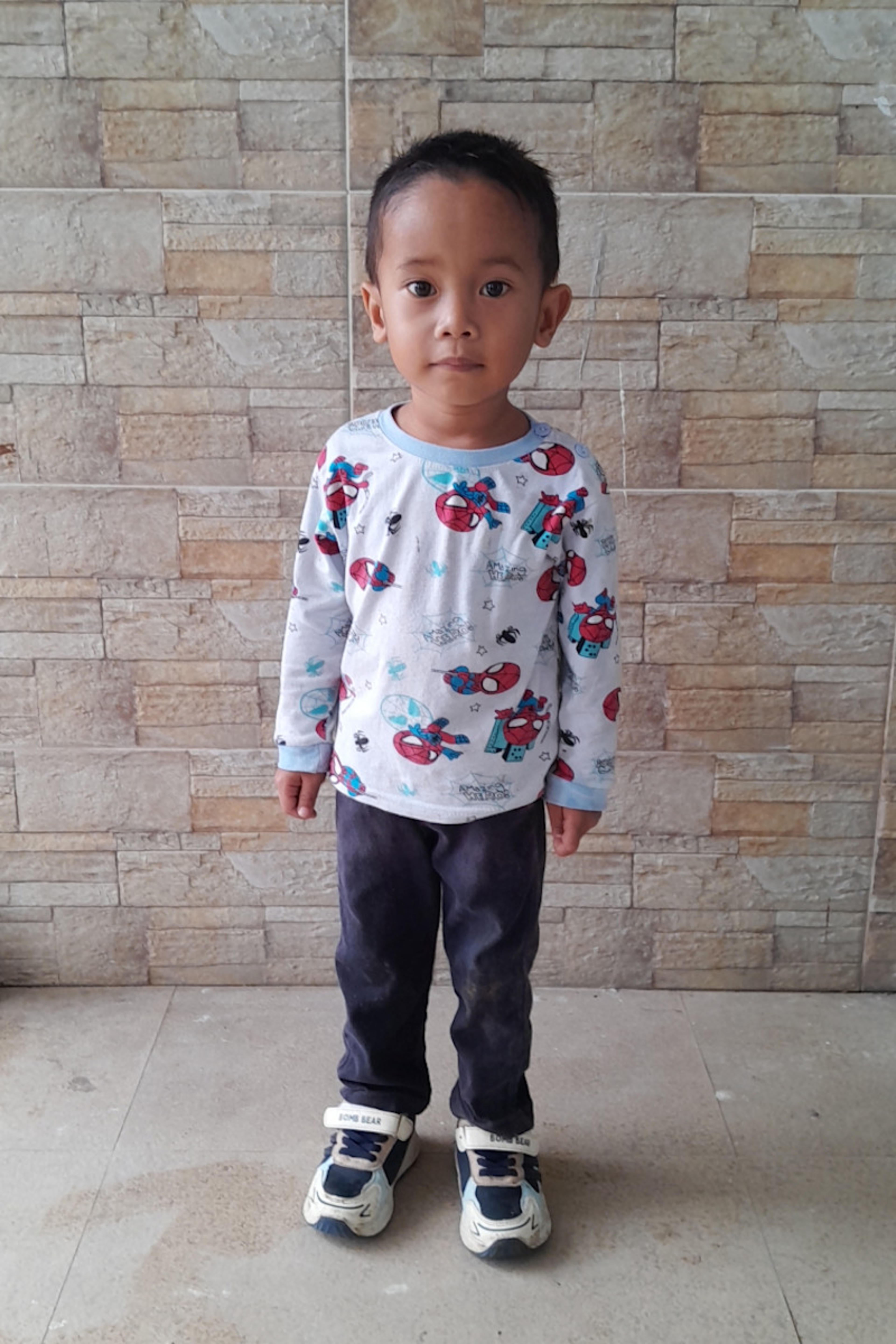 An unsponsored boy named Dores from Indonesia who has waited 605 days for a sponsor.