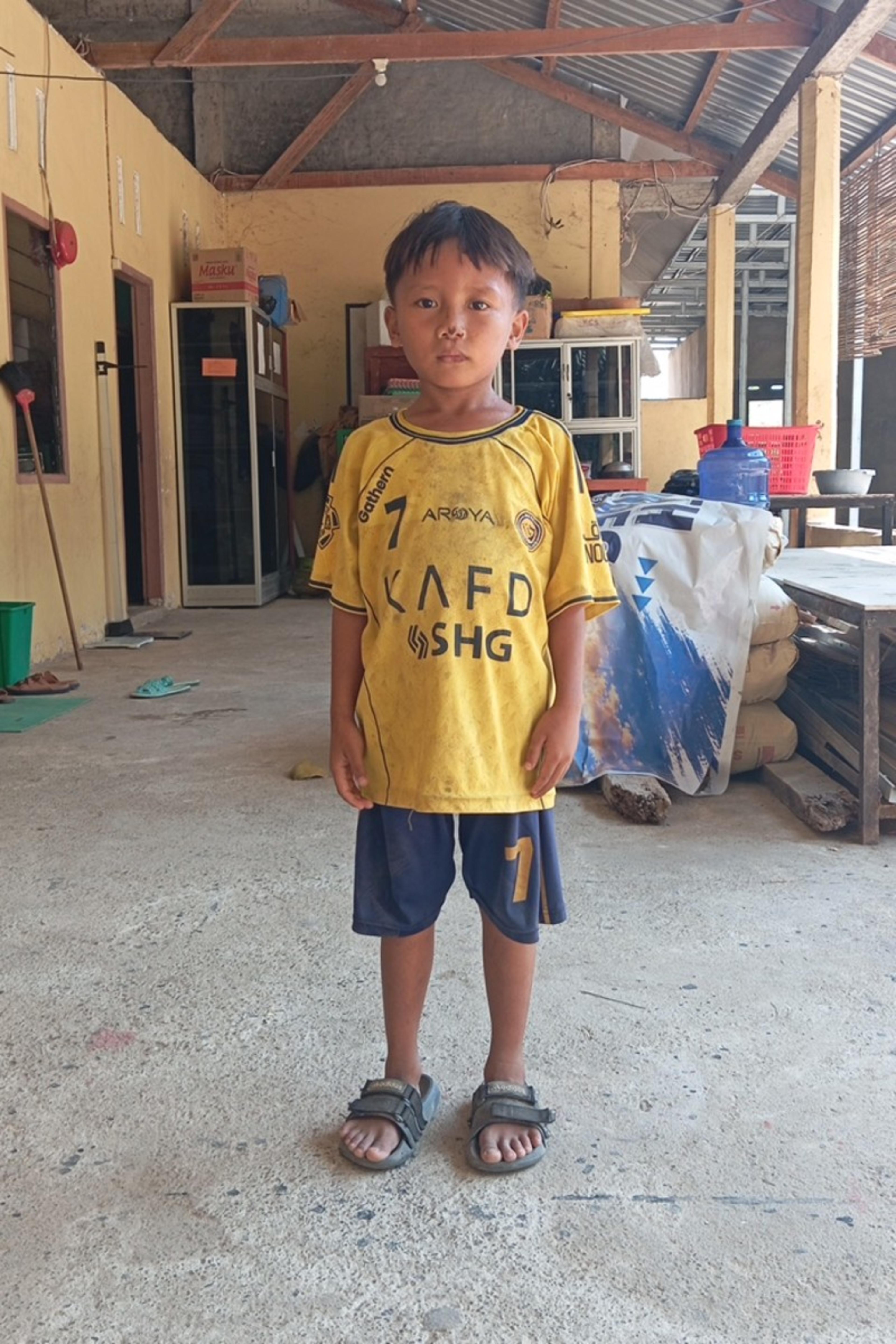 An unsponsored boy named Dirga from Indonesia who has waited 553 days for a sponsor.