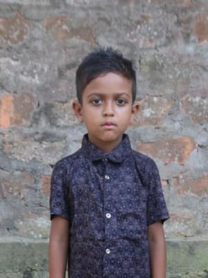 An unsponsored boy named Bishu from Bangladesh who is vulnerable to exploitation and has waited 505 days for a sponsor