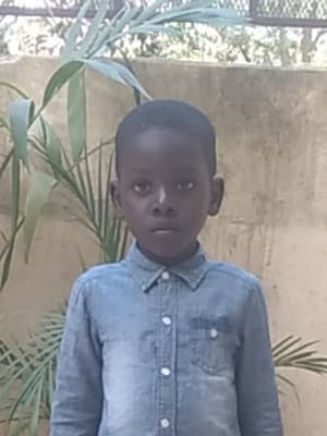 An unsponsored boy named Jo from Haiti who is vulnerable to exploitation and has waited 450 days for a sponsor