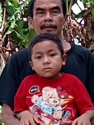 An unsponsored boy named Otnel from Indonesia who has waited 430 days for a sponsor