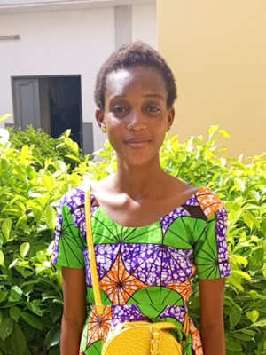 An unsponsored girl named Dadoh from Togo who lives in an AIDS-affected area and is vulnerable to exploitation
