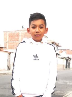 An unsponsored boy named Maykel from Ecuador who has waited 523 days for a sponsor