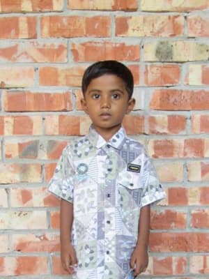 An unsponsored boy named Nishan from Bangladesh who is vulnerable to exploitation and has waited 458 days for a sponsor